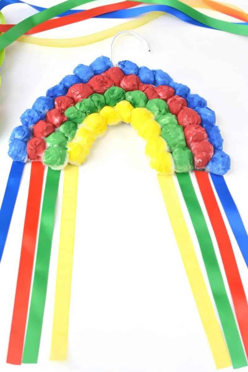 If you are looking for a rainbow kids craft for St. Patrick's Day or just for Spring in general, this colorful Hanging Cotton Ball Rainbow Craft for Kids is the perfect idea.