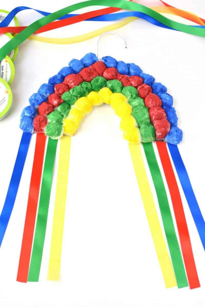 If you are looking for a rainbow kids craft for St. Patrick's Day or just for Spring in general, this colorful Hanging Cotton Ball Rainbow Craft for Kids is the perfect idea.