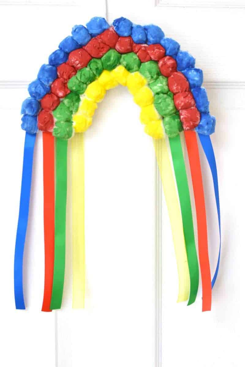 If you are looking for a rainbow kids craft for St. Patrick's Day or just for Spring in general, this colorful Hanging Cotton Ball Rainbow Craft for Kids is the perfect idea.