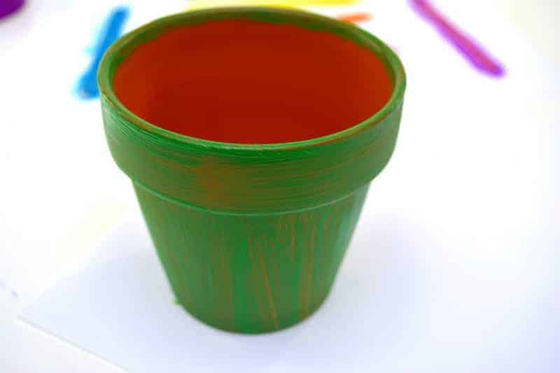 Want to make a fun DIY St. Patrick's Day Decoration for your home or classroom? This end of the rainbow pot of gold planter is the perfect homemade St. Patrick's Day decor idea! It would make a great St. Patrick's Day centerpiece for the table as well!