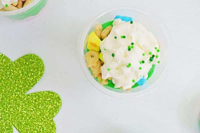 I love how quick and easy these St. Patrick's Day Pudding Parfaits are to make! Simply layer Lucky Charms cereal, pudding, and whipped cream to make this easy, festive, and delicious St. Patrick's Day dessert.