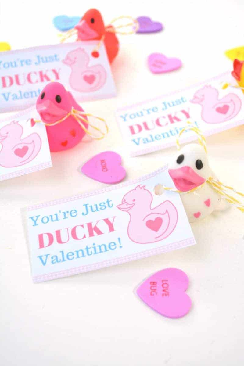 Are you looking for super cute free Valentine printables for your kids to give out this Valentine’s Day? This DIY “You’re Just Ducky” kids valentine is so stinking cute and is very inexpensive to make for the entire class. Plus, these homemade Valentines are something that will put store-bought valentines to shame!