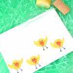 Are you looking for a fun Easter chicks craft idea? This cute baby chicks kids art project is made by stamping wine corks into yellow paint. It’s the perfect kids activity for the rainy (or even snowy) days leading up to Easter.