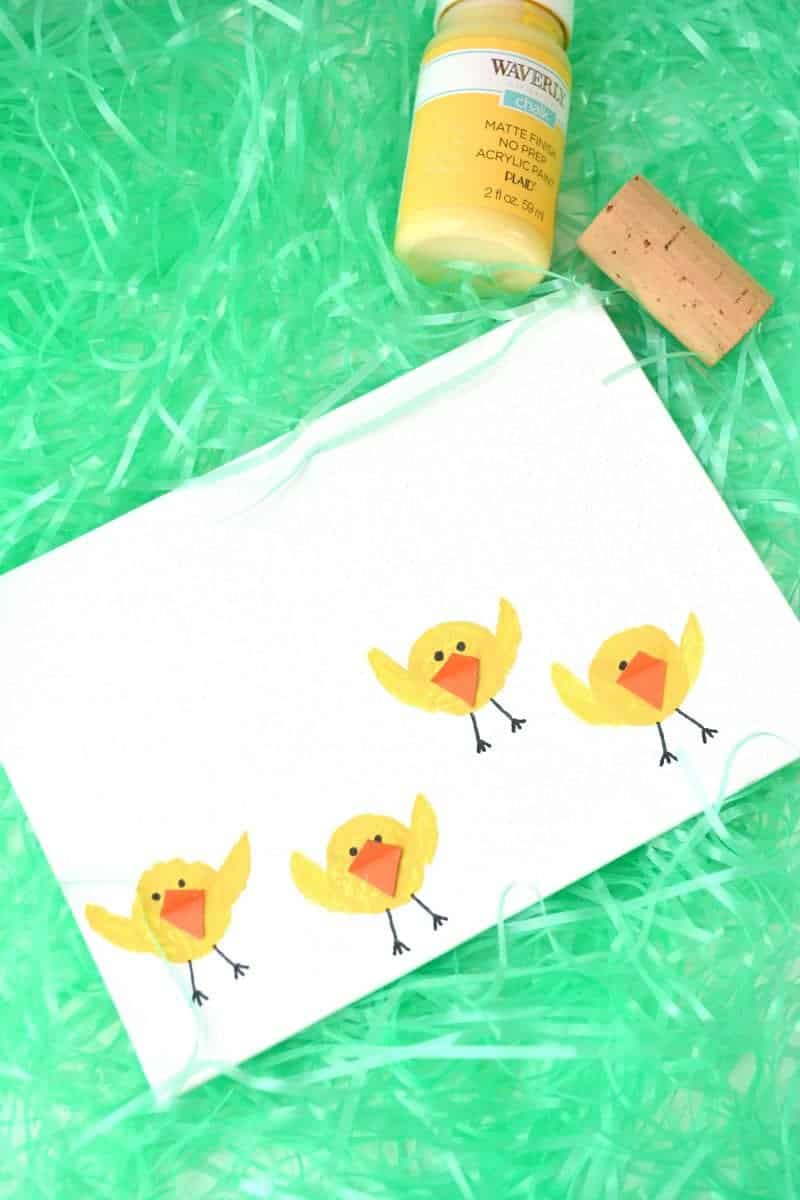 Are you looking for a fun Easter chicks craft idea? This cute baby chicks kids art project is made by stamping wine corks into yellow paint. It’s the perfect kids activity for the rainy (or even snowy) days leading up to Easter.