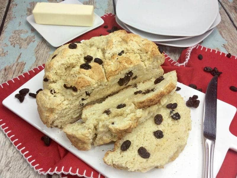 You will love this quick and easy Irish Soda Bread with Raisins recipe made with flour, baking soda, salt, sugar, egg, butter, buttermilk, and raisins for St. Patrick's Day or any time of year!