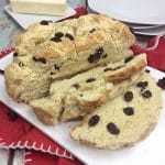 You will love this quick and easy Irish Soda Bread with Raisins recipe made with flour, baking soda, salt, sugar, egg, butter, buttermilk, and raisins for St. Patrick's Day or any time of year!