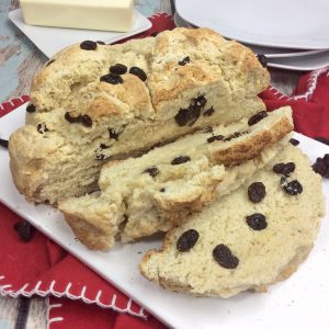 You will love this quick and easy Irish Soda Bread with Raisins recipe made with flour, baking soda, salt, sugar, egg, butter, buttermilk, and raisins for St. Patrick's Day or any time of year!