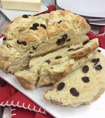You will love this quick and easy Irish Soda Bread with Raisins recipe made with flour, baking soda, salt, sugar, egg, butter, buttermilk, and raisins for St. Patrick's Day or any time of year!