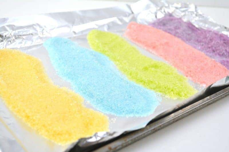 Salt glitter is fun to make and use in arts & crafts projects like this colorful salt glitter Easter egg canvas. Find out how to make homemade salt glitter with this step-by-step tutorial. 