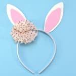 Get in the Easter spirit with this easy no sew DIY Bunny Ears Headband. This easy bunny headband craft is perfect for boys and girls alike, as the flower can be left out or replaced with a little top hat!