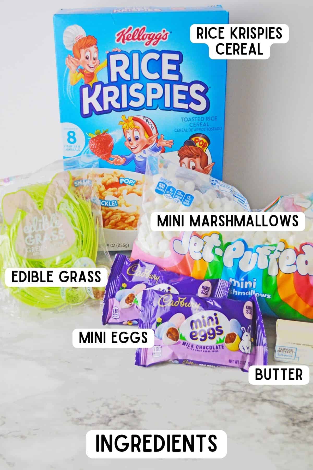 Ingredients on countertop: Box of Rice Krispies cereal, bag of jet-puffed mini marshmallows, butter, 2 small bags of Cadbury mini eggs, and a bag of green apple flavored edible grass.