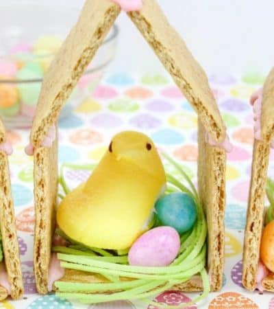Peeps chicks houses are a fun no bake Easter treat perfect for the kids this Spring season. Made using Peeps Chicks, graham crackers, egg candies, and edible grass, this cute Easter recipe is perfect to make with the little ones.