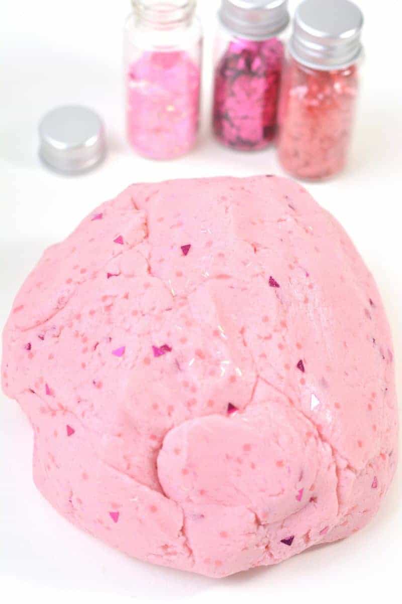This glittery pink princess playdough recipe is perfect for your little princess! This easy homemade no cook playdough is made with cake mix, icing, food coloring, olive oil, and glitter. You could use edible glitter instead for a completely edible playdough recipe as well!