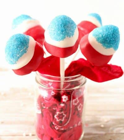 Firecracker Strawberry Pops are a fun and festive dessert perfect for a 4th of July BBQ, patriotic Memorial Day celebration, or laid back Labor Day. These no bake red, white, and blue treats are easy to make, adorable, and tasty as can be.