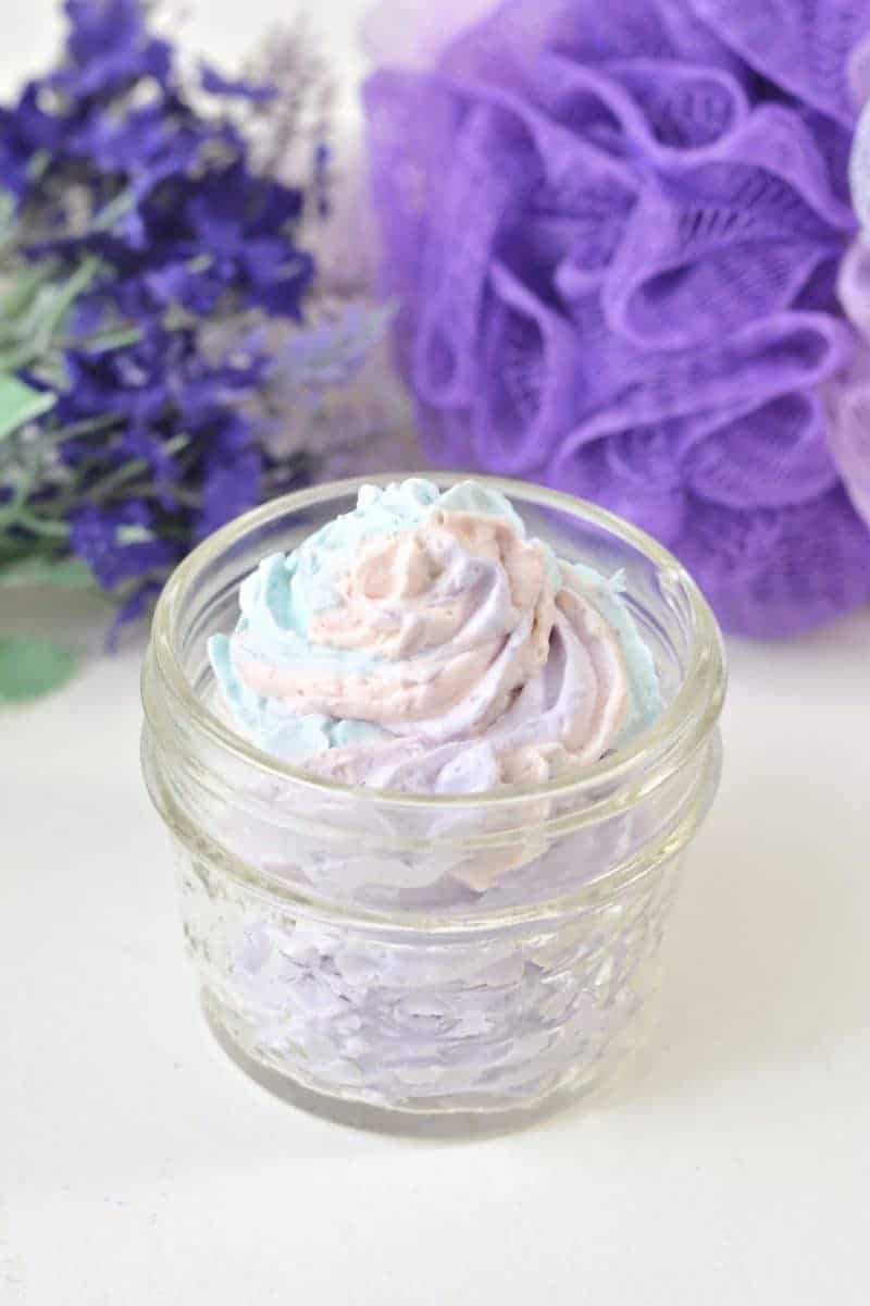 An easy DIY recipe for a magical unicorn whipped body butter made using shea butter, coconut oil, mica powder, and essential oils. In addition to being beautiful, this rainbow unicorn homemade body butter is rich, creamy, and moisturizing as well.