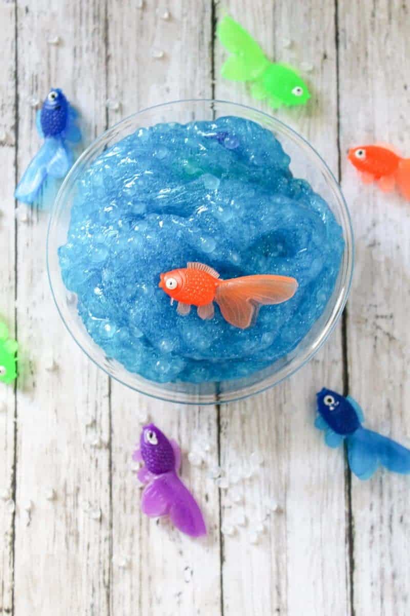 This blue and glittery, borax-free, under the sea ocean slime is a fun DIY sensory activity perfect for the summer months. 