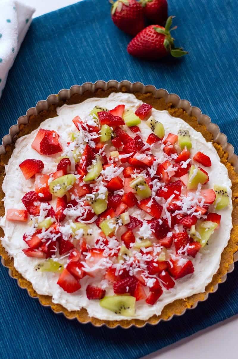 With cream cheese and fresh fruit on top of a homemade graham cracker crust, this no-bake fruit pizza recipe makes a perfect summer dessert. 