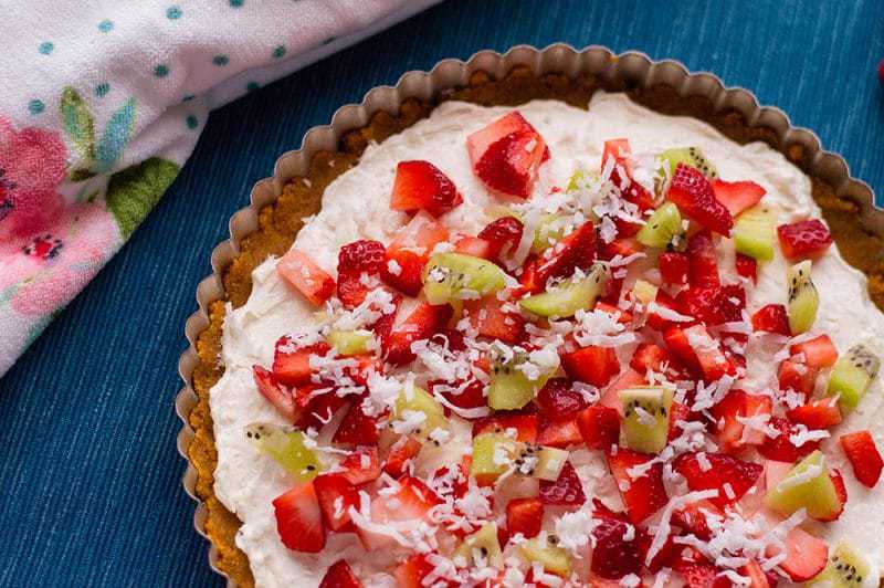 With cream cheese and fresh fruit on top of a homemade graham cracker crust, this no-bake fruit pizza recipe makes a perfect summer dessert. 