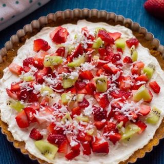 With cream cheese and fresh fruit on top of a homemade graham cracker crust, this no-bake fruit pizza recipe makes a perfect summer dessert. 