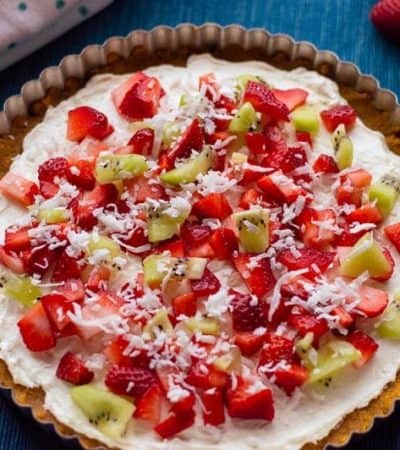 With cream cheese and fresh fruit on top of a homemade graham cracker crust, this no-bake fruit pizza recipe makes a perfect summer dessert. 
