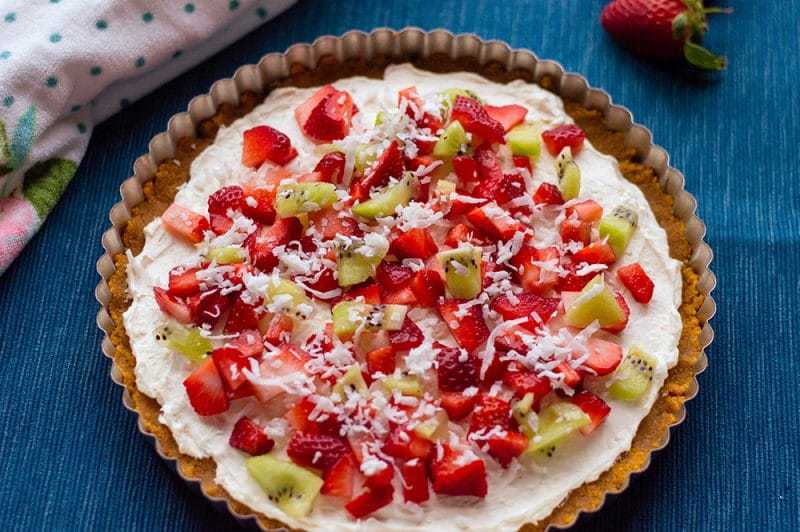 With cream cheese and fresh fruit on top of a homemade graham cracker crust, this no-bake fruit pizza recipe makes a perfect summer dessert. 