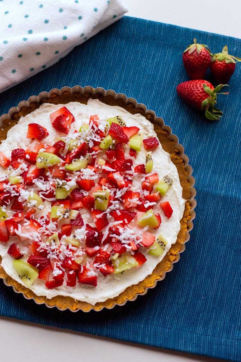 With cream cheese and fresh fruit on top of a homemade graham cracker crust, this no-bake fruit pizza recipe makes a perfect summer dessert. 