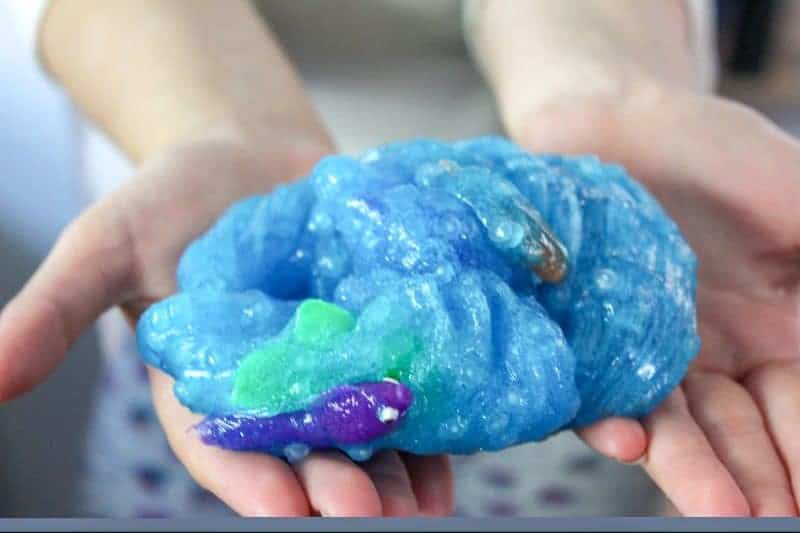 This blue and glittery, borax-free, under the sea ocean slime is a fun DIY sensory activity perfect for the summer months. 