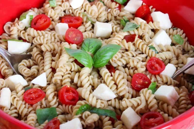 Made with fresh mozzarella, tomatoes, and basil; and tossed in a balsamic vinaigrette, this Caprese Pasta Salad recipe makes the perfect summer side dish. It is quick and easy to make, and great for barbecues, potlucks, or an easy summer lunch.