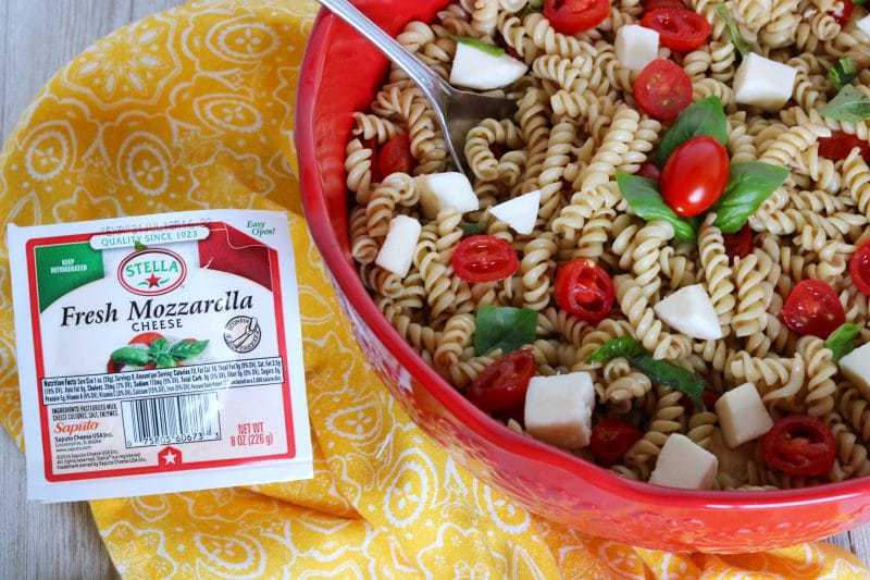 Made with fresh mozzarella, tomatoes, and basil; and tossed in a balsamic vinaigrette, this Caprese Pasta Salad recipe makes the perfect summer side dish. It is quick and easy to make, and great for barbecues, potlucks, or an easy summer lunch.