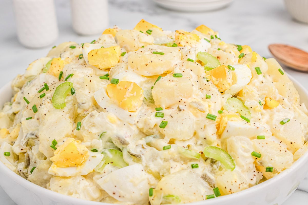 Creamy potato salad with chopped eggs and celery.