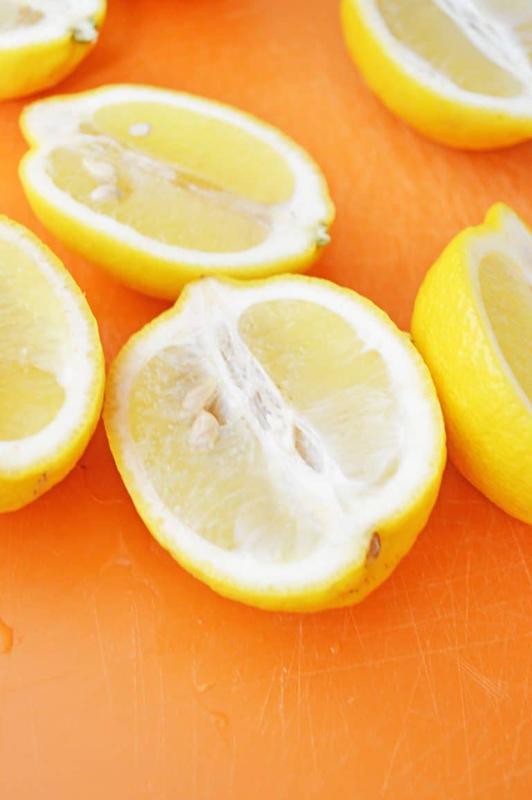 Strawberry Lemonade Jello Shots With Vodka Served In Lemon Wedges