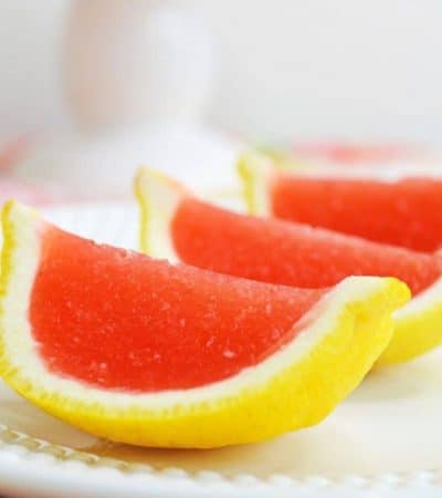 Strawberry lemonade jello shots made with vodka and served in lemon wedges. Don't be fooled -- these lemon wedge jello shots are actually very easy to make!