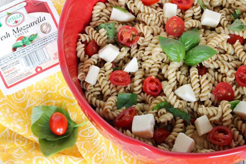 Made with fresh mozzarella, tomatoes, and basil; and tossed in a balsamic vinaigrette, this Caprese Pasta Salad recipe makes the perfect summer side dish. It is quick and easy to make, and great for barbecues, potlucks, or an easy summer lunch.