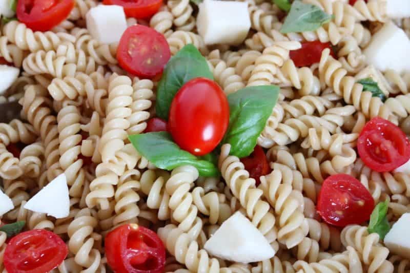 Made with fresh mozzarella, tomatoes, and basil; and tossed in a balsamic vinaigrette, this Caprese Pasta Salad recipe makes the perfect summer side dish. It is quick and easy to make, and great for barbecues, potlucks, or an easy summer lunch.