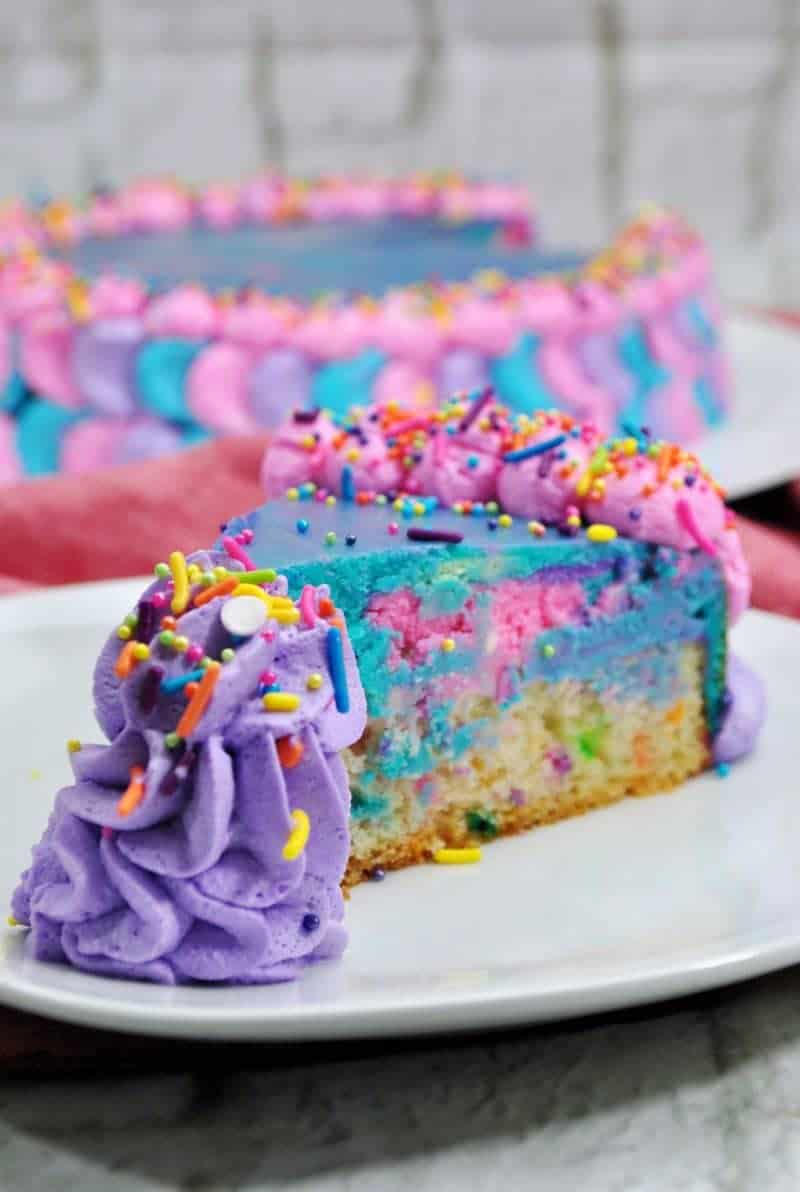 This unicorn cheesecake not only looks magical, but it tastes magical too. This funfetti-cheesecake combo is the perfect cake for a unicorn themed party!