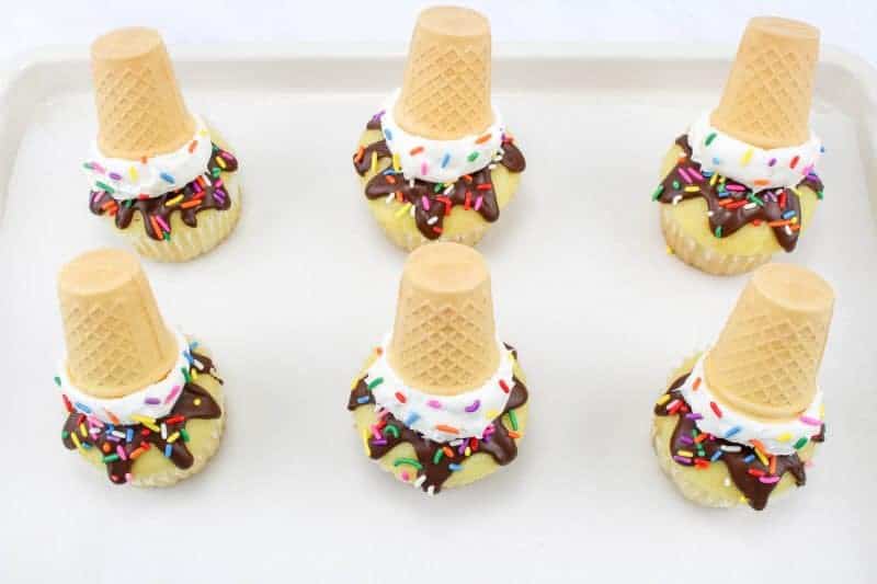 Melting ice cream cone cupcakes are easy to make and designed to look like a ice cream cone that fell upside down and is beginning to melt.