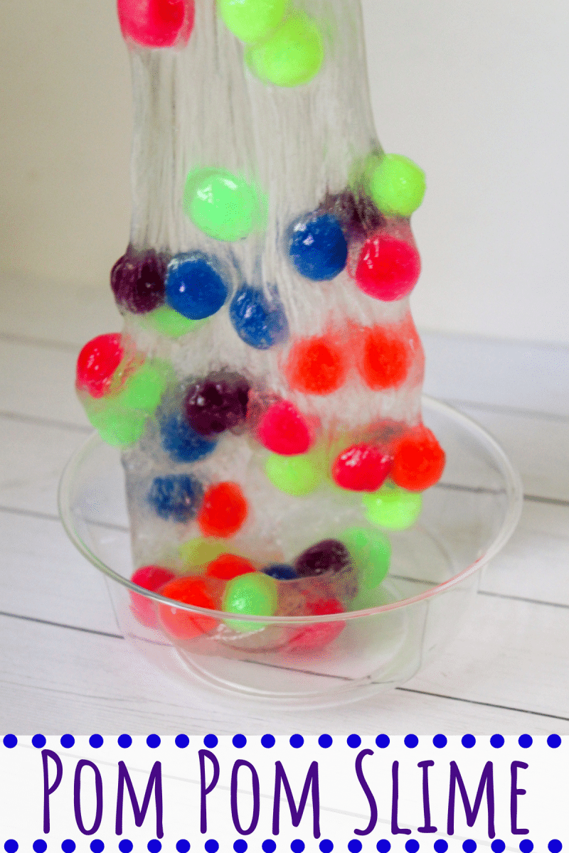 This 4-ingredient pom pom slime features brightly colored pom poms suspended in a clear slime for a bright, colorful, and fun sensory activity for kids.