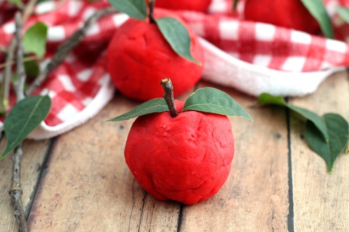 A non-toxic, taste-safe, apple scented playdough recipe perfect for Fall sensory play at home or in the classroom. Takes only 10 minutes to make!