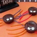 Spider brownie treats made with brownie bites, candy eyeballs, and licorice ropes.