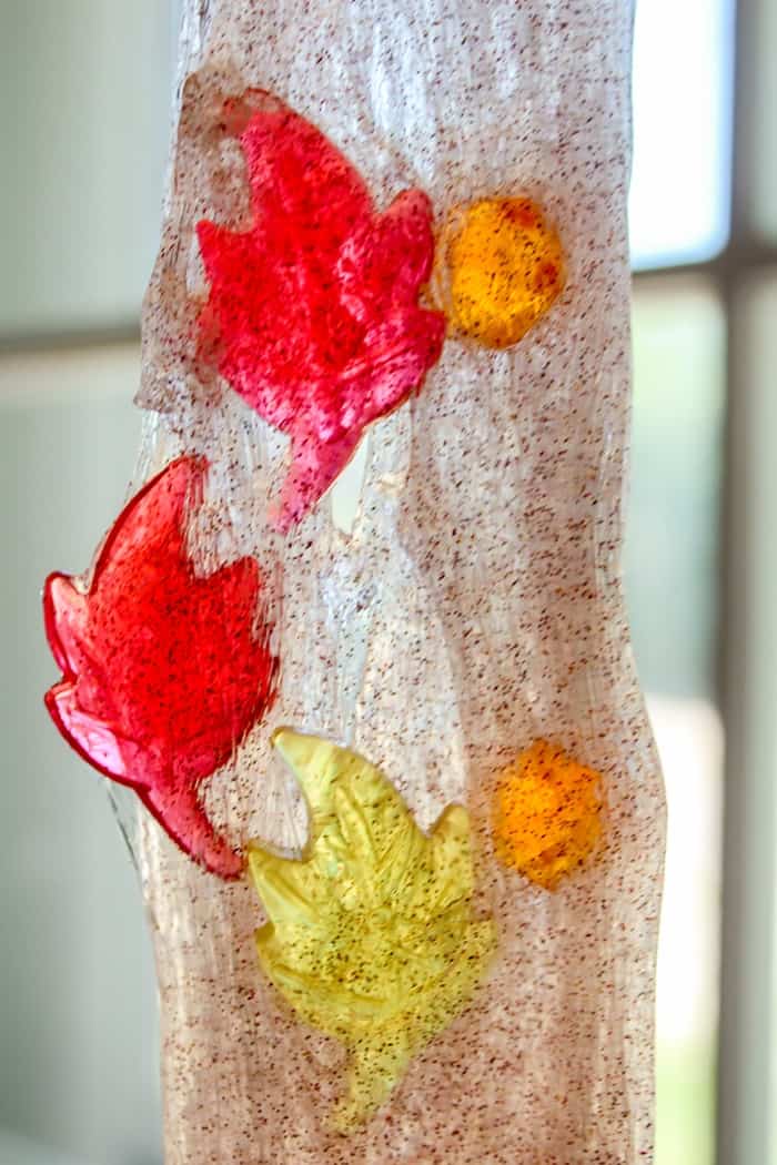 Cinnamon-scented glitter fall slime made without borax is a perfect as a preschool science activity or for sensory play.