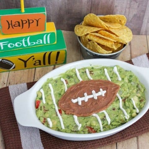 Homemade guacamole is a big game must have. This easy guacamole football recipe makes a perfect game day snack for the big game or any game!