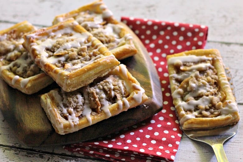 An apple danish recipe with a delicious crumb topping and drizzle of icing. This tasty apple crumb danish makes for a sweet breakfast or brunch option.