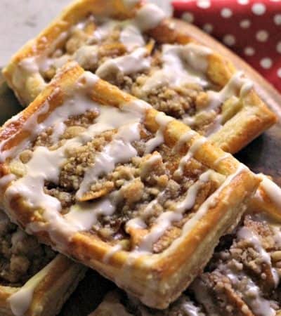 An apple danish recipe with a delicious crumb topping and drizzle of icing. This tasty apple crumb danish makes for a sweet breakfast or brunch option.