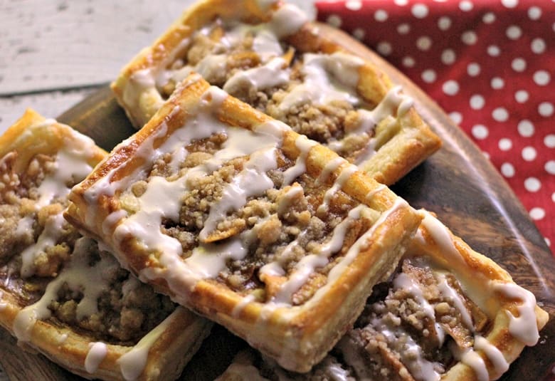 An apple danish recipe with a delicious crumb topping and drizzle of icing. This tasty apple crumb danish makes for a sweet breakfast or brunch option.