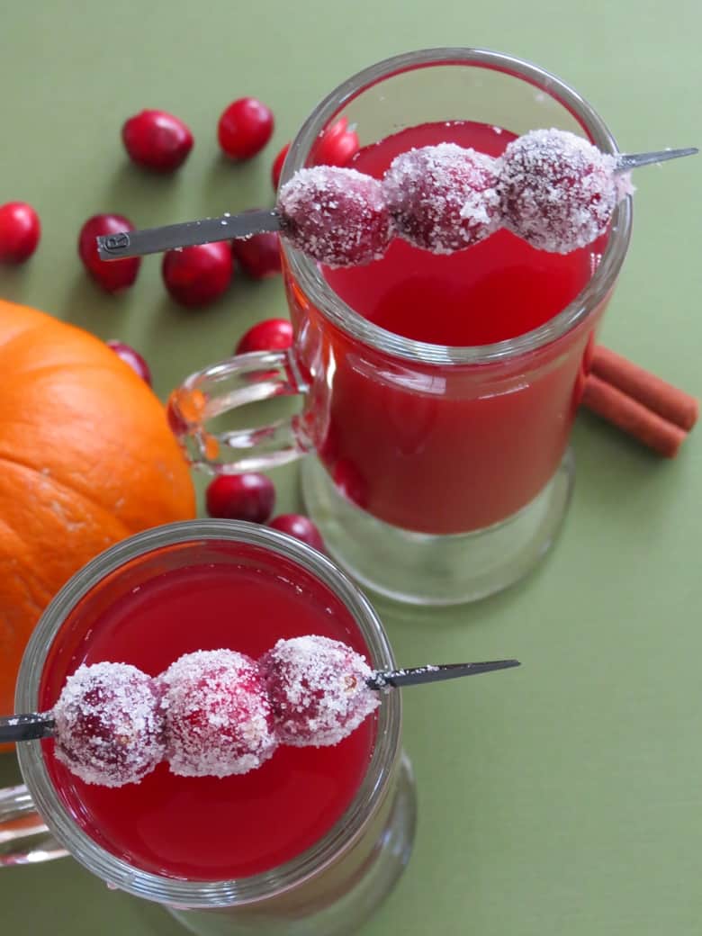 Cranberry apple cider made with sweet tea is an amazing twist on typical hot apple cider, and is easy to make at home in your crockpot or slow cooker.