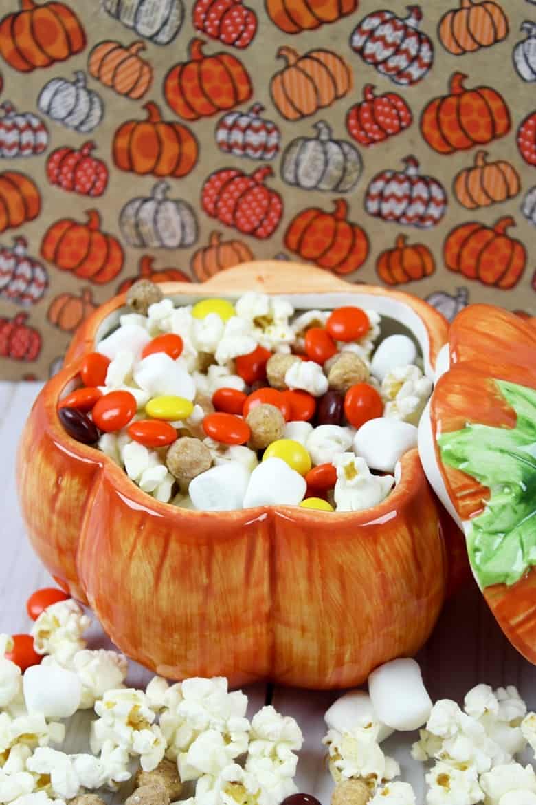 Yummy Fall snack mix served in a pumpkin container.