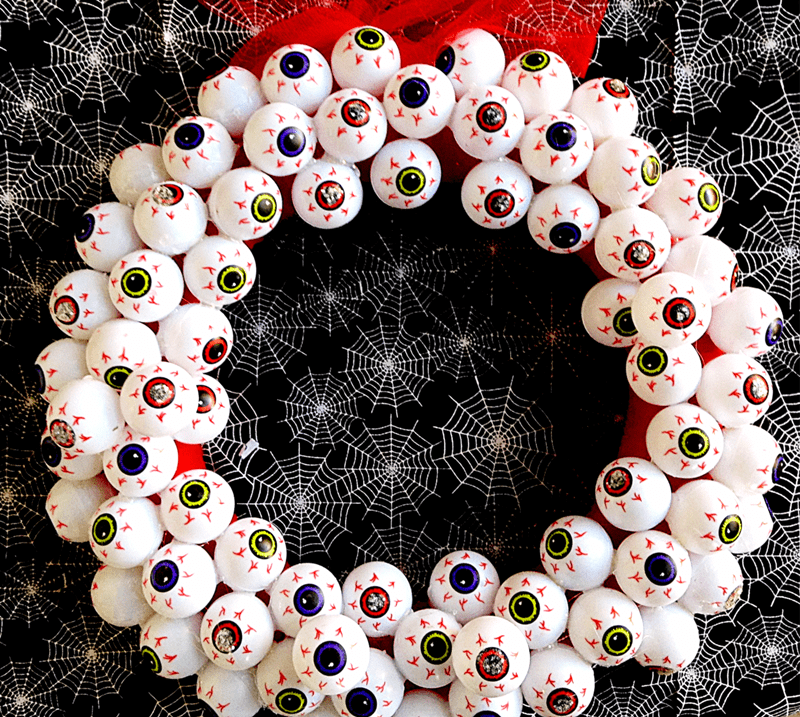 Add a little bit of Halloween flair to your front door with this easy-to-make "always watching" creepy eyeball DIY Halloween wreath.