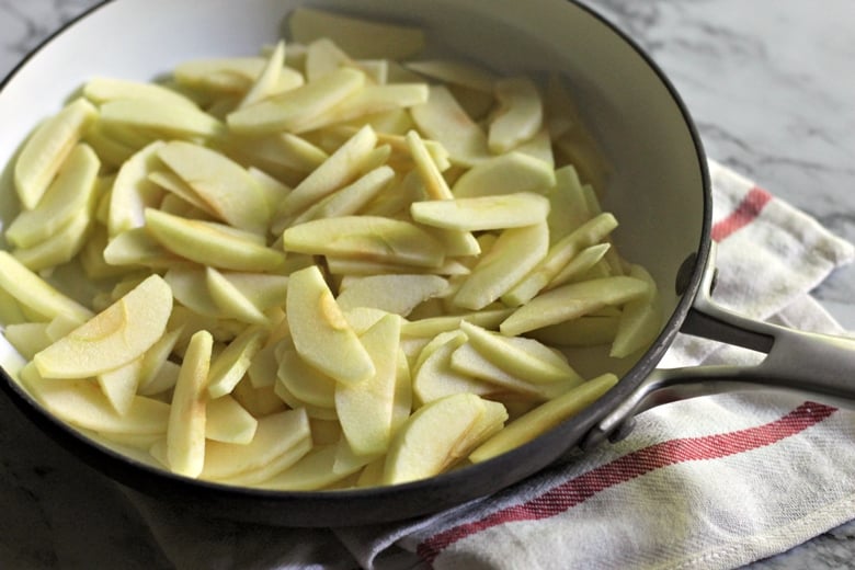 Next you will prepare the apple filling by cooking the apples in a frying pan along with butter, brown sugar, cornstarch, and cinnamon. 