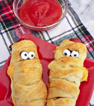 Mummy hot dogs are a fun Halloween dinner, perfect after a busy night of trick-or-treating. Plus, they are ridiculously easy to make using crescent rolls.