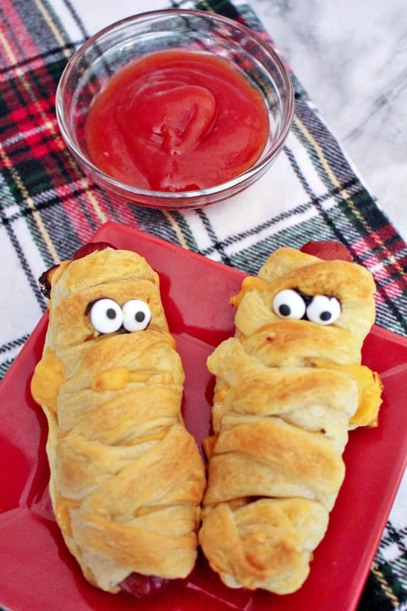 Mummy hot dogs are a fun Halloween dinner, perfect after a busy night of trick-or-treating. Plus, they are ridiculously easy to make using crescent rolls.